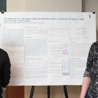 Applied computer science graduate students, Esteban Echeverri Jaramillo (right) and Griffin Going (left), standing in front of their poster.
